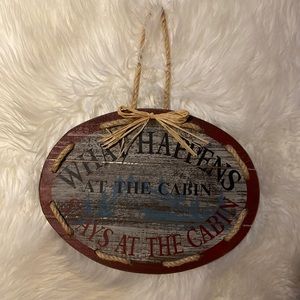 What happens at the cabin stays at the cabin Wooden sign